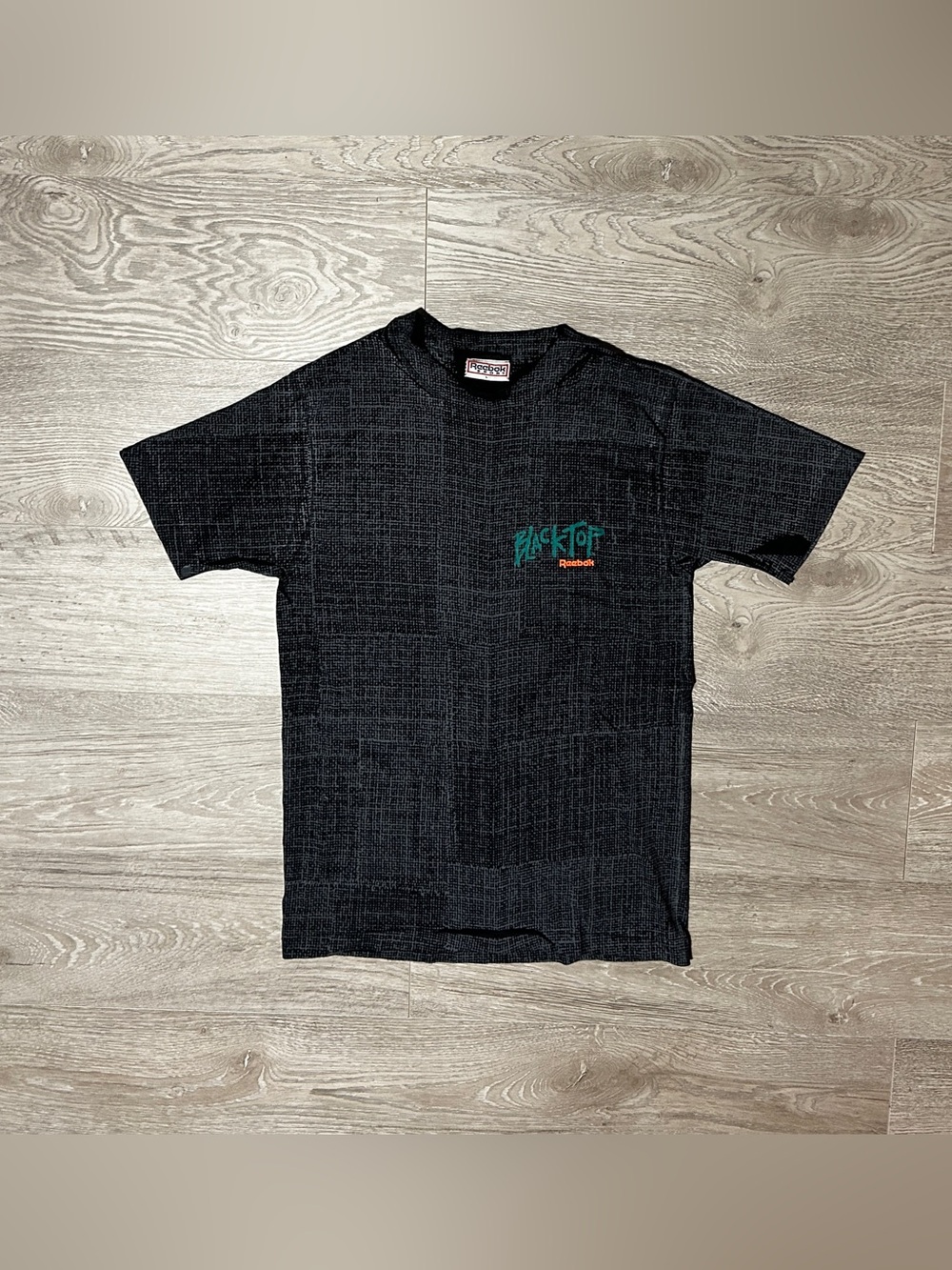 Vintage 90s Reebok Black Top All Over Print Mens Graphic T-Shirt